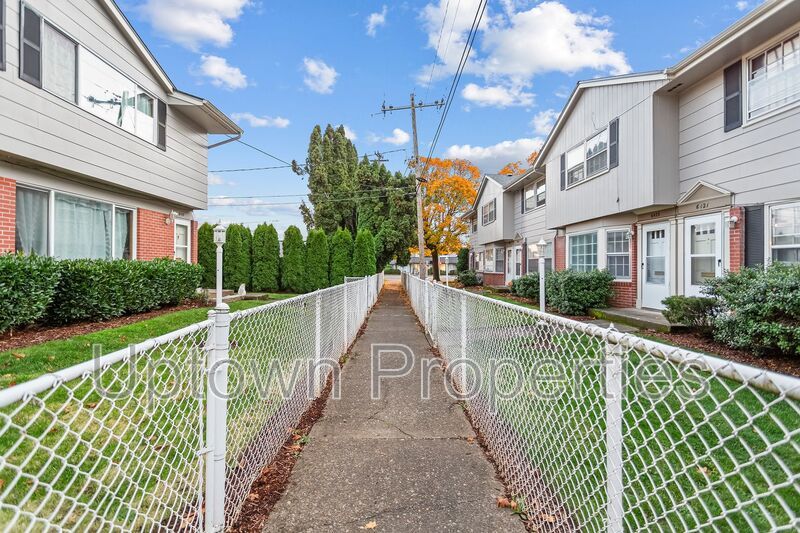 FREE First Month's Rent: 2BD/1.5BTH Townhome + Private Fenced Patio + W/D in unit + Parking Included property image